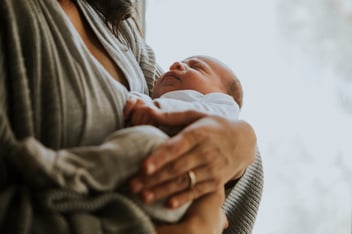 Mother holding her baby