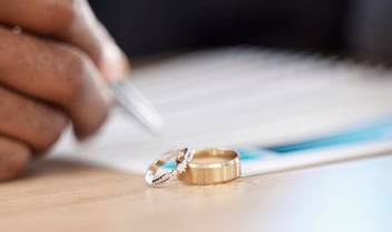 Divorce, rings and signature on paperwork